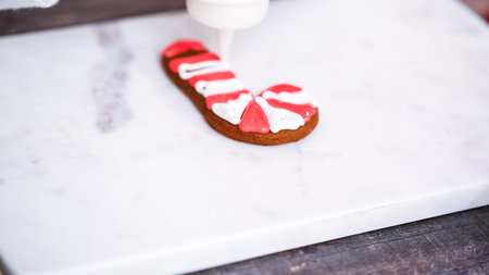 Step by step. Decorating gingerbread and sugar cookies with royal icing for Christmas.