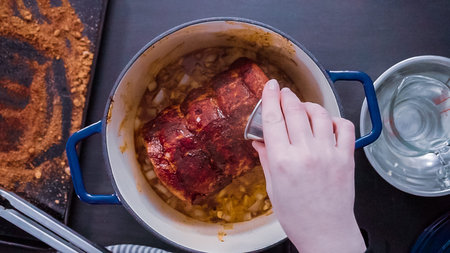 Flat lay. Step by step. Cooking boneless pork roast in cast iron dutch oven.