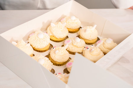 Easter bunny cupcakes in a white cupcake box.