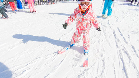 Keystoone, Colorado, USA-January 5, 2019 - Little girl learning how to ski down the hill on alpine mountains.のeditorial素材