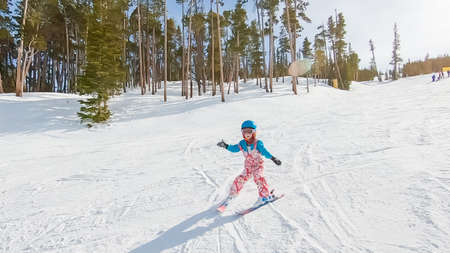 Keystoone, Colorado, USA-January 5, 2019 - Little girl learning how to ski down the hill on alpine mountains.のeditorial素材