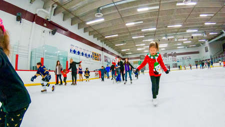 Denver, Colorado, USA-December 16, 2018 - Public ice skating at indoor ice skating rink.のeditorial素材