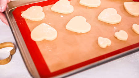 Step by step. Cutting out shapes from sugar cookie dough with cookie cutters.の写真素材