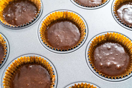 Baking chocolate cupcakes in cupcake pan.の写真素材