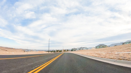 Driving through new residential neighborhood in suburbia.