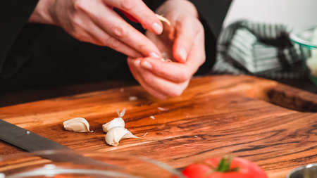 Step by step. Crushing garlic for beet soup, borscht.の写真素材