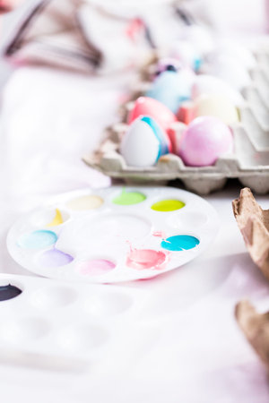 Craft Easter eggs painted by kids with acrylic paint.