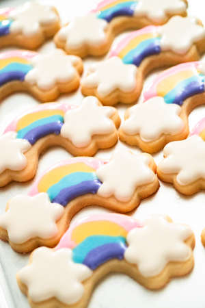 Close up. Decorating unicorn themed sugar cookies with royal icing.の写真素材