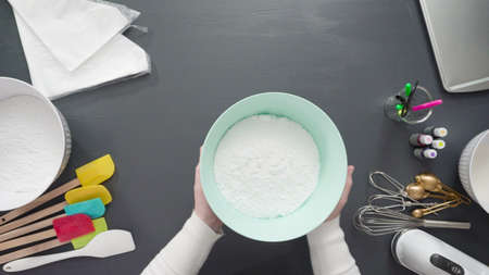 Step by step. Flat lay. Preparing simple royal icing to decorate sugar cookies.の写真素材