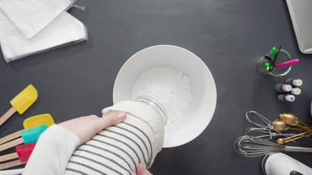 Step by step. Flat lay. Preparing simple royal icing to decorate sugar cookies.