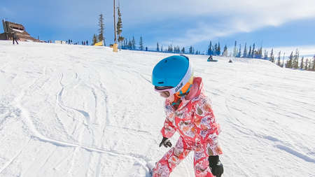 Keystoone, Colorado, USA-January 5, 2019 - Little girl learning how to ski down the hill on alpine mountains.のeditorial素材