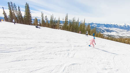 Keystoone, Colorado, USA-January 5, 2019 - Little girl learning how to ski down the hill on alpine mountains.のeditorial素材