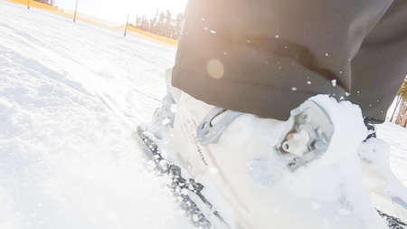 Keystoone, Colorado, USA-January 5, 2019 - Close up of woman's boots and skis skiing on alpine mountain slopes.のeditorial素材