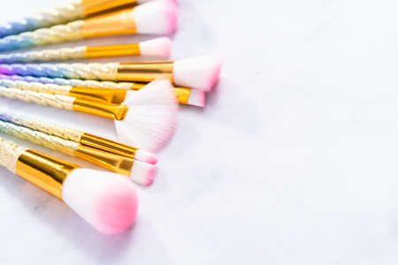 Unicorn color makeup brushes on a marble background.の写真素材