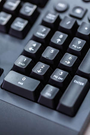Modern black computer keyboard with raised keys.の写真素材