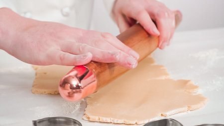 Step by step. Rolling out Sugar cookie dough with French rolling pin.