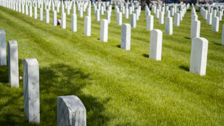 Denver, Colorado, USA-May 26, 2019 - An endless rows of white marble gravestones at the
 Fort Logan National Cemetery on Memorial Day.のeditorial素材