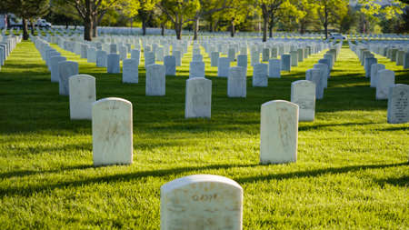 Denver, Colorado, USA-May 26, 2019 - An endless rows of white marble gravestones at the Fort Logan National Cemetery on Memorial Day.のeditorial素材