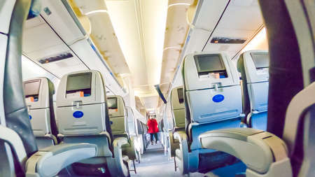 Economy class seats in mid size passenger airplane.のeditorial素材