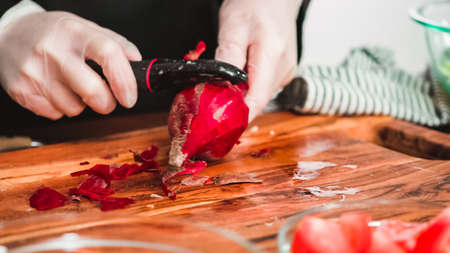 Step by step. Slicing beetroot into the small cubes for beet soup, borscht.の写真素材