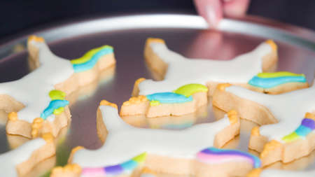 Step by step. Decorating unicorn sugar cookies with royal icing.の写真素材