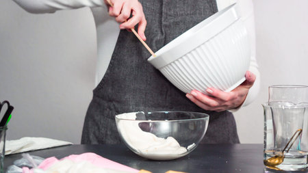 Step by step. Mixing in food coloring into the royal icing to decorate sugar cookies.
