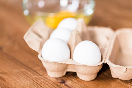 White organic eggs on the table for making challah bread.