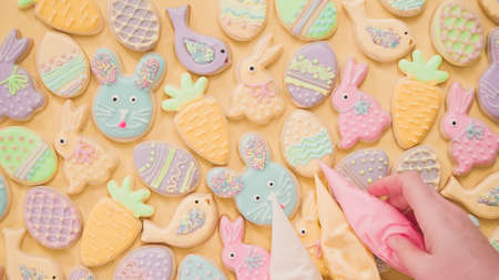 Flat lay. Easter sugar cookies decorated with pastel colors of royal icing.の写真素材