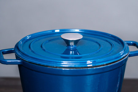 Blue enameled cast iron covered dutch oven with leed.