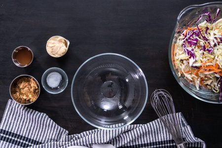 Flat lay. Making homemade coleslaw in a glass bowl.