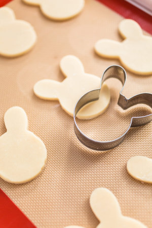 Unbaked sugar cookies on a baking sheet.
