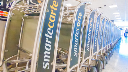 Houston, Texas, USA-January 11, 2019 - Row of airport luggage carts at Houston International Airport.のeditorial素材