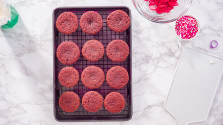 Flat lay. Step by step. Cooling red velvet cupcakes on a kitchen drying rack.
