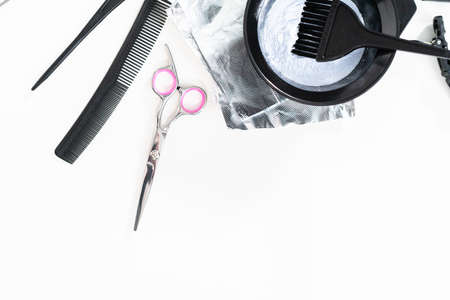 Hair color dye powder in a black plastic mixing bowl on a white background.の写真素材