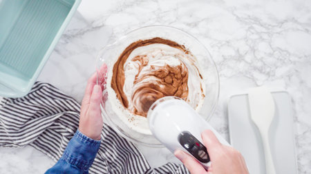 Flat lay. Step by step. Preparing homemade chocolate ice cream in a hand kitchen mixer.