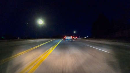 Denver, Colorado, USA-January 17, 2020 - Driving on typical paved roads at night in suburban America.のeditorial素材