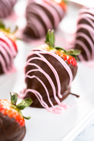 Chocolate dipped strawberries drizzled with melted chocolate.