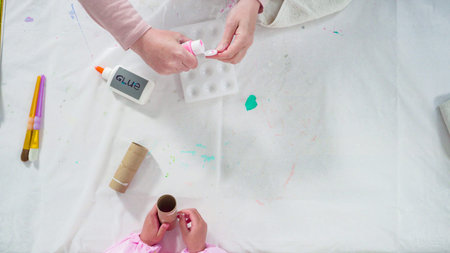 Flat lay. Step by step. Making unicorns out of paper and empty toilet paper rolls.