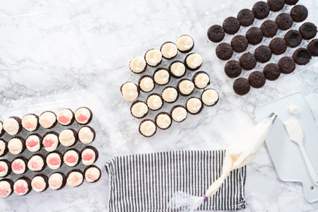 Chocolate mini cupcakes with Italian buttercream frosting decorated with glittery chocolate...