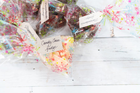 Wrapped macadamia and candy cane fudge in Christmas packaging.の写真素材