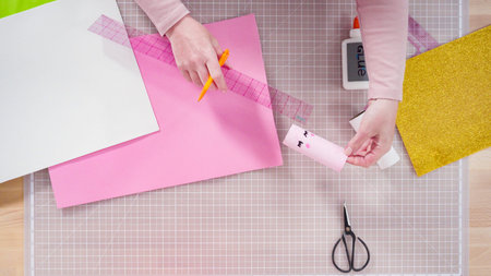 Flat lay. Step by step. Making unicorns out of paper and empty toilet paper rolls.