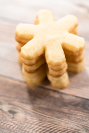 Pile of freshly baked sugar cookies in snowflake shape.の写真素材