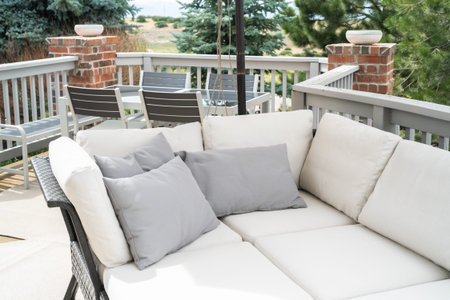 Patio of a luxury single-family home furnished with modern furniture.
