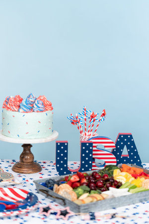 Cake, cookies, and fruit and vegetable snack tray at the July 4th celebration party.