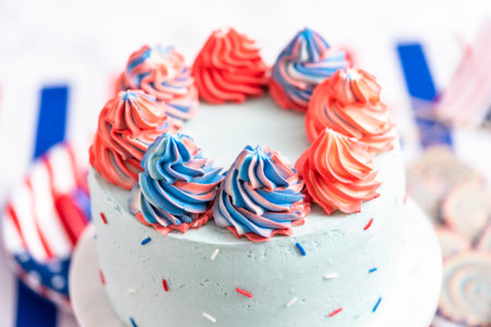 Cake, cookies, and fruit and vegetable snack tray at the July 4th celebration party.