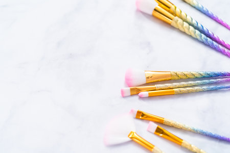 Unicorn color makeup brushes on a marble background.の写真素材