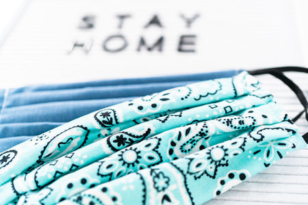 STAY HOME sign on message board with a homemade face mask.の写真素材