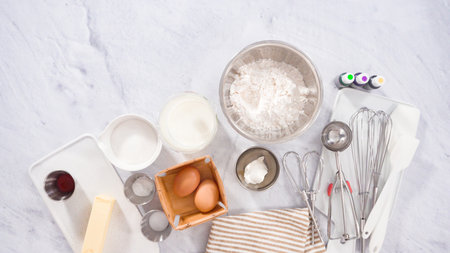 Flat lay. Step by step. Ingredient to bake vanilla Mardi Gras cupcakes.の写真素材