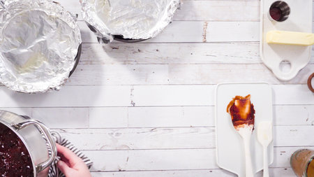 Flat lay. Step by step. Mixing ingredients in the cooking pot to make simple chocolate fudge.の写真素材