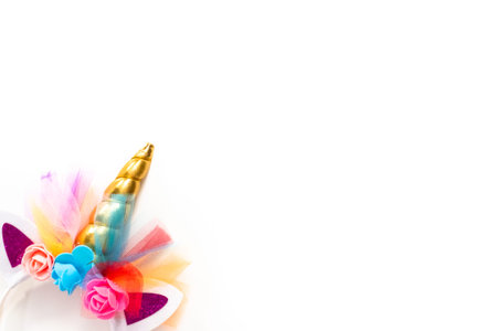 Flat lay. Colorful unicorn headband on a white background.